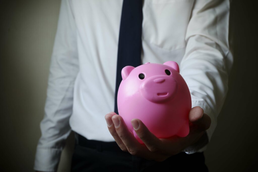 Business Man Showing Piggy Bank Business Finance Concept