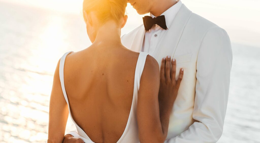 Evening Sun Shines Beautiful Wedding Couple Hugging Before Sea