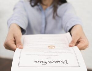 Close Up Woman Holding Divorce Form