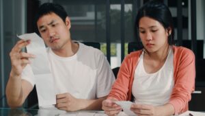 Young Asian Pregnant Couple Records Income Expenses Home Dad Worried Serious Stress While Record Budget Tax Financial Document Working Living Room Home